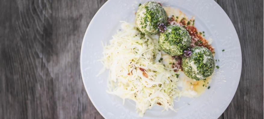 A typical South Tyrolean dish: spinach dumplings and cabbage salad