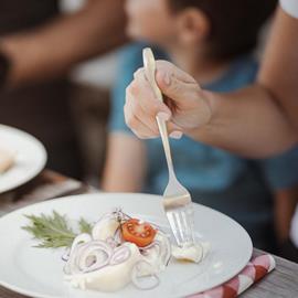 A family is having a meal at a mountain hut